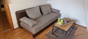 Sofa mit Schlaffunktion und Bettkasten